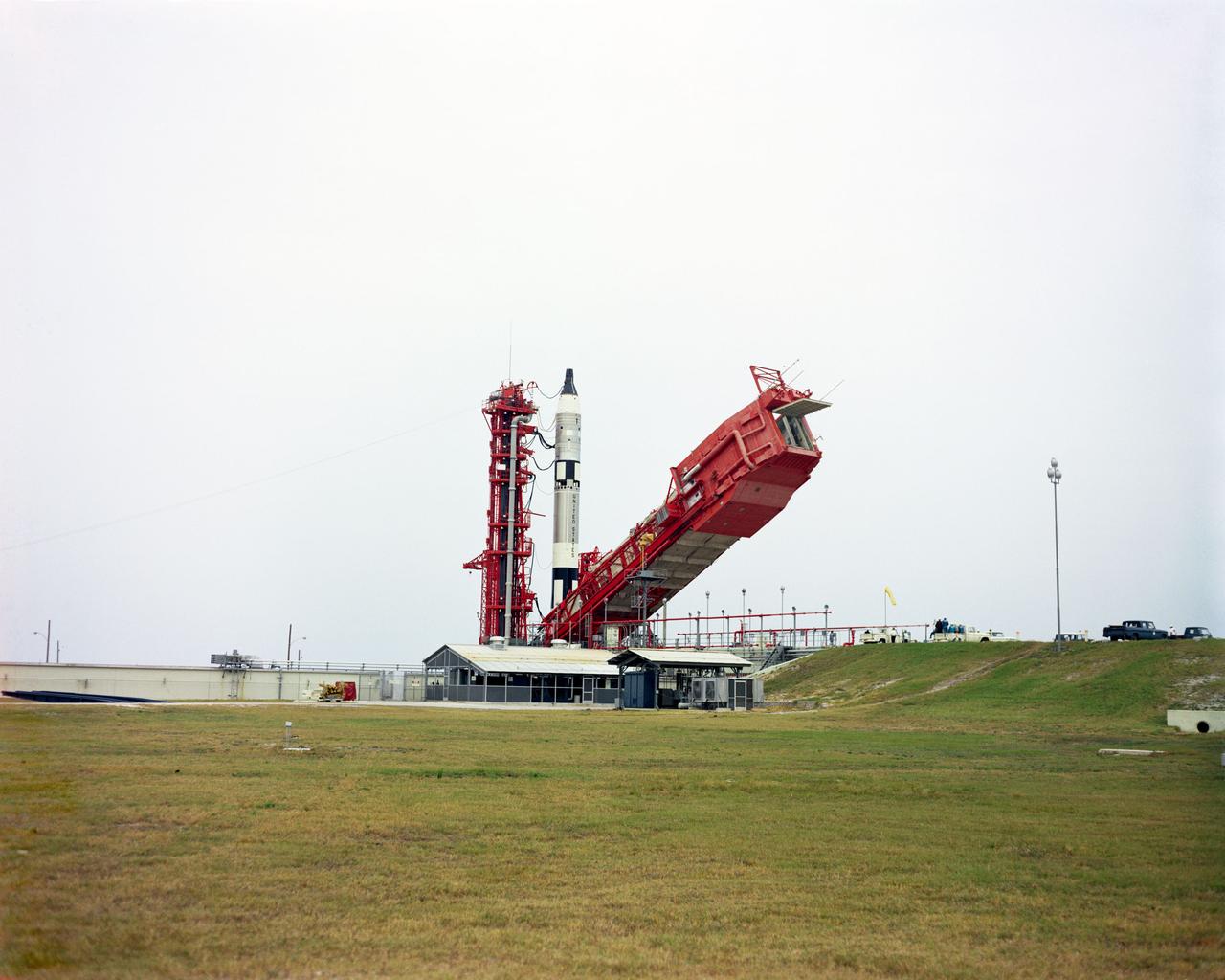 S65-61632 (4 Dec. 1965) --- The erector is lowered at Pad 19 during the final minutes of the Gemini-7 countdown. Inside the spacecraft atop the launch vehicle are astronaut Frank Borman, command pilot, and James A. Lovell Jr., pilot. The National Aeronautics and Space Administration has scheduled Gemini-7 as a 14-day mission in space. Liftoff occurred at 2:30 p.m. (EST), Dec. 4, 1965. Photo credit: NASA