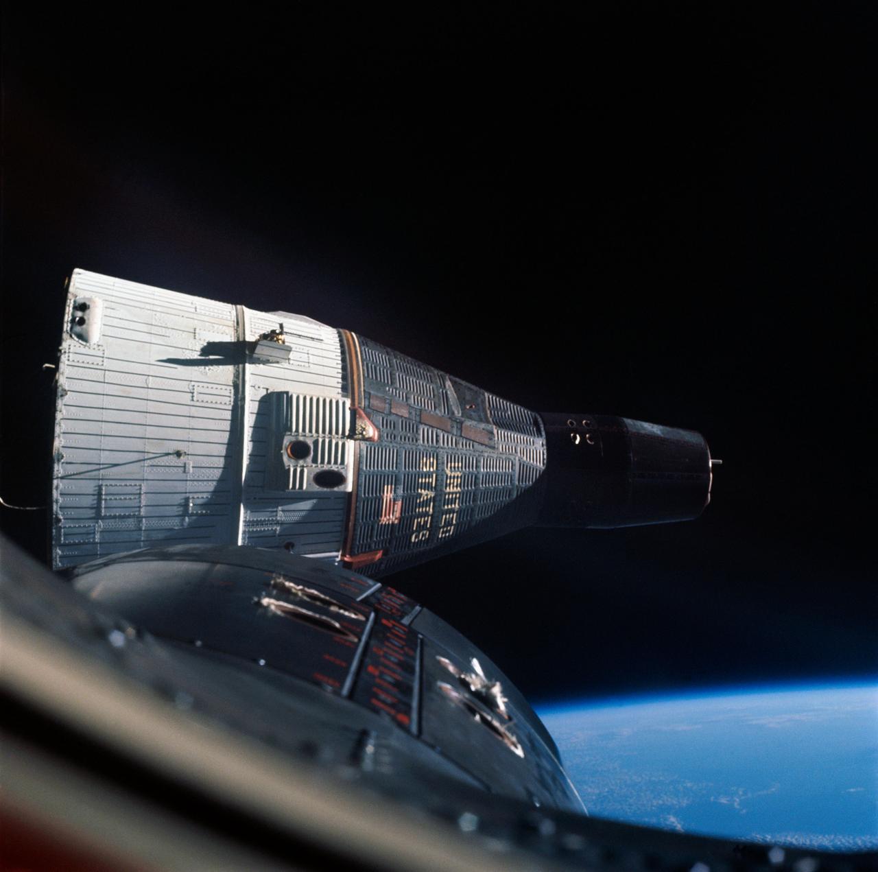 S65-63194 (15 Dec. 1965) --- This photograph of the National Aeronautics and Space Administration's (NASA) Gemini-7 spacecraft was taken through the hatch window of the Gemini-6 spacecraft during rendezvous and station keeping maneuvers at an altitude of approximately 160 miles on Dec. 15, 1965. The photograph was taken with a Hasselblad camera using Kodak SO 217 film with an ASA of 1964. Photo credit: NASA or National Aeronautics and Space Administration