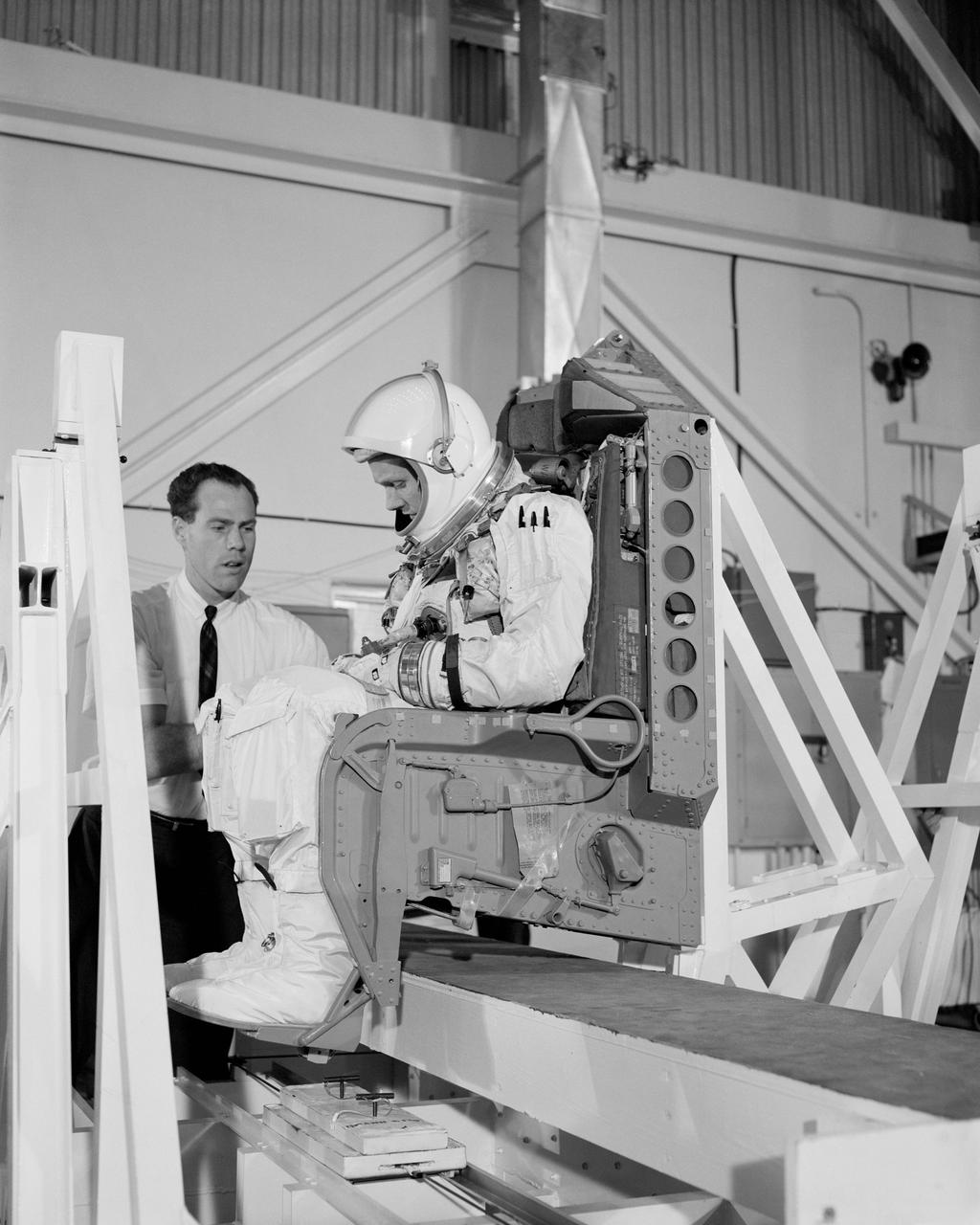 S66-22933 (18 Feb. 1966) --- Astronaut Neil A. Armstrong undergoes weight and balance tests in the Pyrotechnic Installation Building, Merritt Island, Kennedy Space Center, Florida. Photo credit: NASA