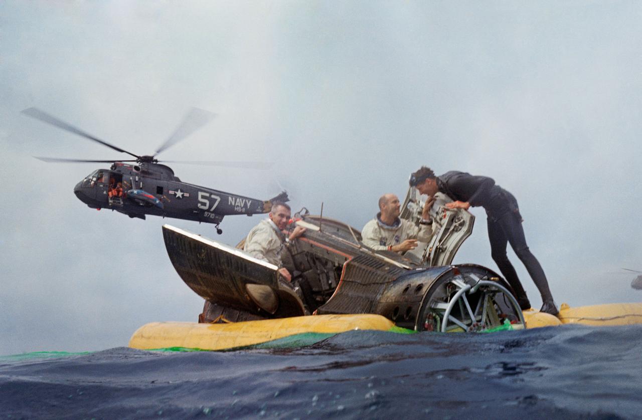 S66-34124 (6 June 1966) --- Astronauts Eugene A. Cernan and Thomas P. Stafford sit with their Gemini 9A spacecraft hatches open while awaiting the arrival of the recovery ship U.S.S. Wasp.