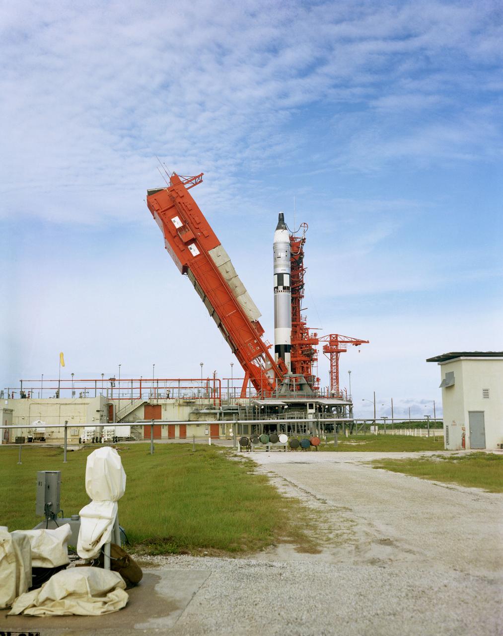 S66-50765 (12 Sept. 1966) --- The erector at Launch Complex 19 is lowered during the Gemini-11 prelaunch countdown. Awaiting the launch in the Gemini-11 spacecraft atop the Gemini Launch Vehicle-11 are astronauts Charles Conrad Jr., command pilot, and Richard F. Gordon Jr., pilot. Liftoff was at 9:42 a.m. (EST), Sept. 12, 1966. Photo credit: NASA