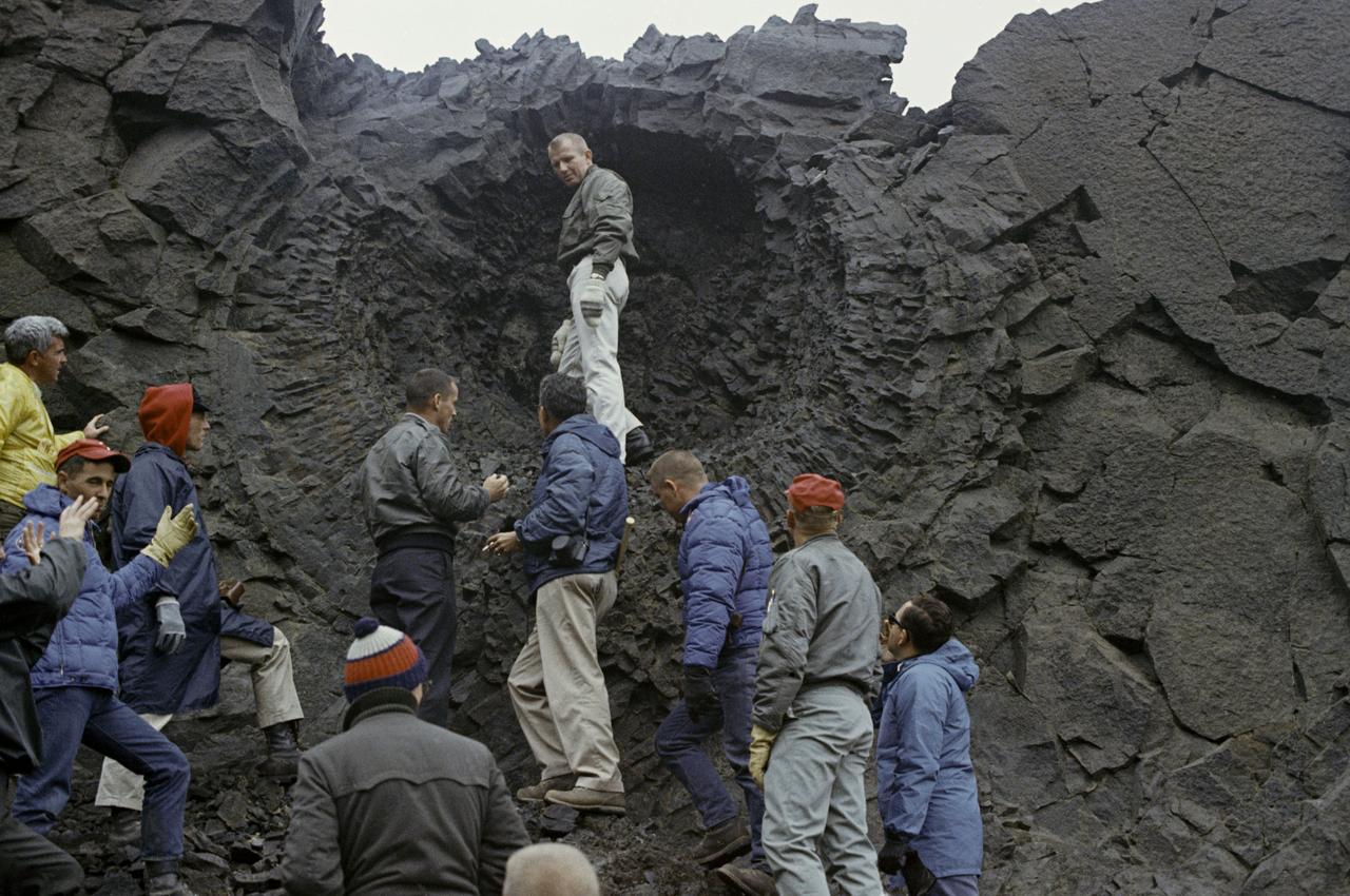 Apollo astronauts study rock formations during a geology field training in Iceland in 1967. 