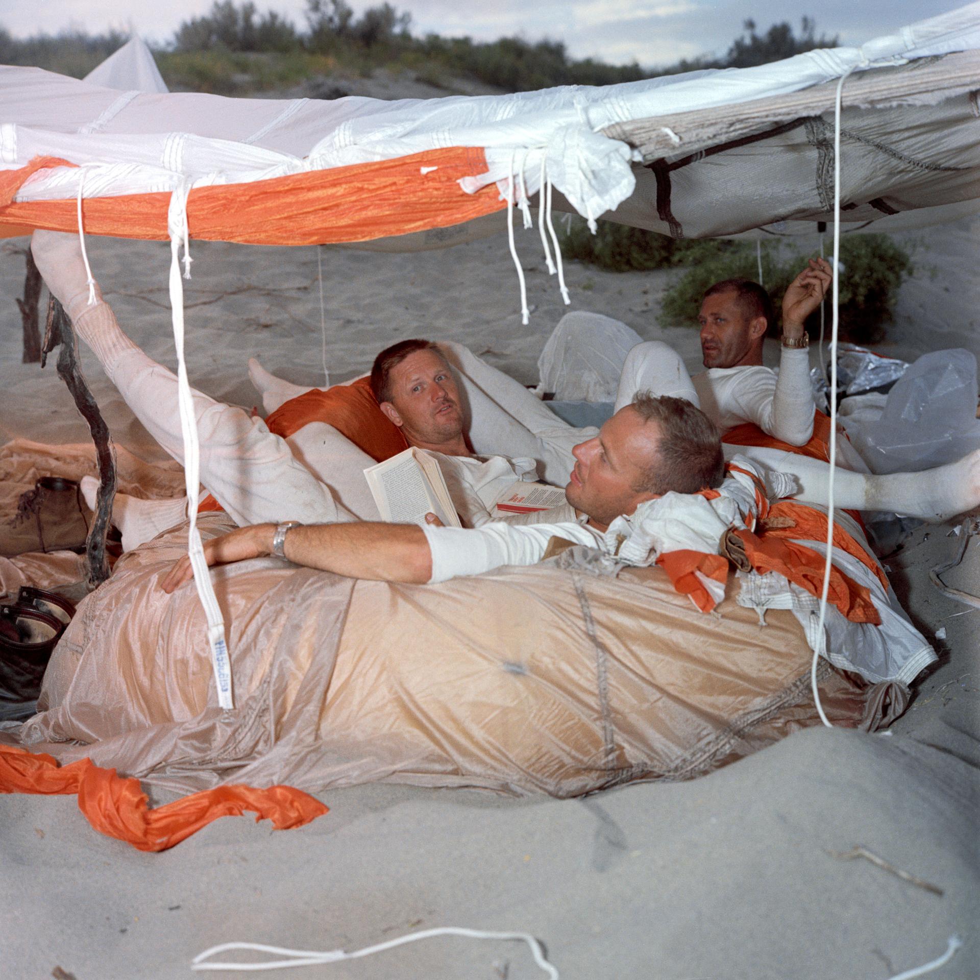 Jack Lousma, Don Lind, and Bill Pogue participate in desert survival training