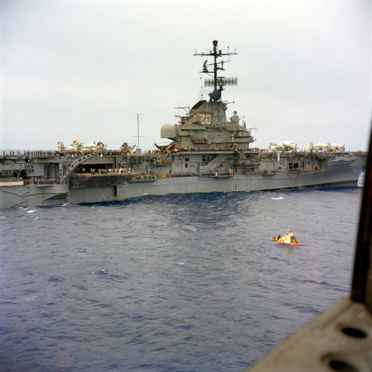 U.S.S. Bennington comes alongside the floating Apollo spacecraft 017 Command Module during recovery operations in the mid-Pacific Ocean. The Command Module splashed down at 3:37 p.m., November 9, 1967, 934 nautical miles northwest of Honolulu, Hawaii.