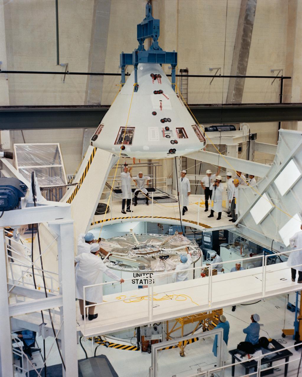 S68-17301 (6 Dec. 1967) --- Apollo Spacecraft 020 Command Module is hoisted into position for mating with Service Module in the Kennedy Space Center's Manned Spacecraft Operations Building. Spacecraft 020 will be flown on the Apollo 6 (Spacecraft 020/Saturn 502) unmanned, Earth-orbital space mission.