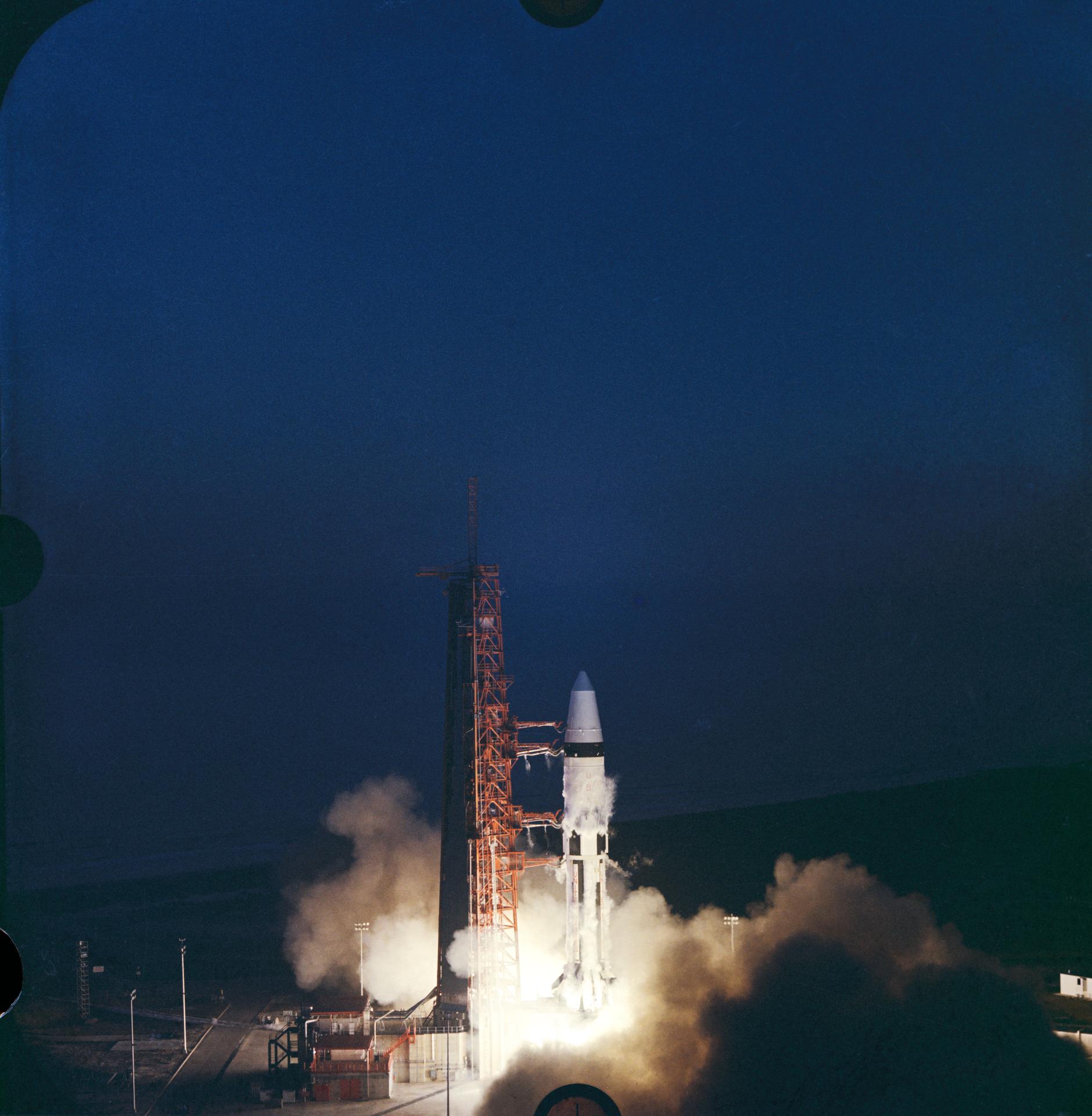 Apollo 5 liftoff into a dark sky