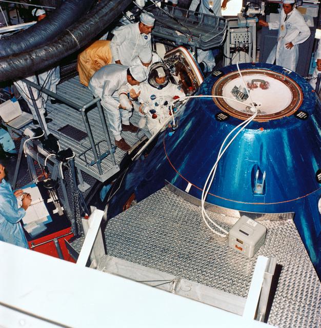 NASA image: Astronaut John Young ingresses Apollo spacecraft command module in training