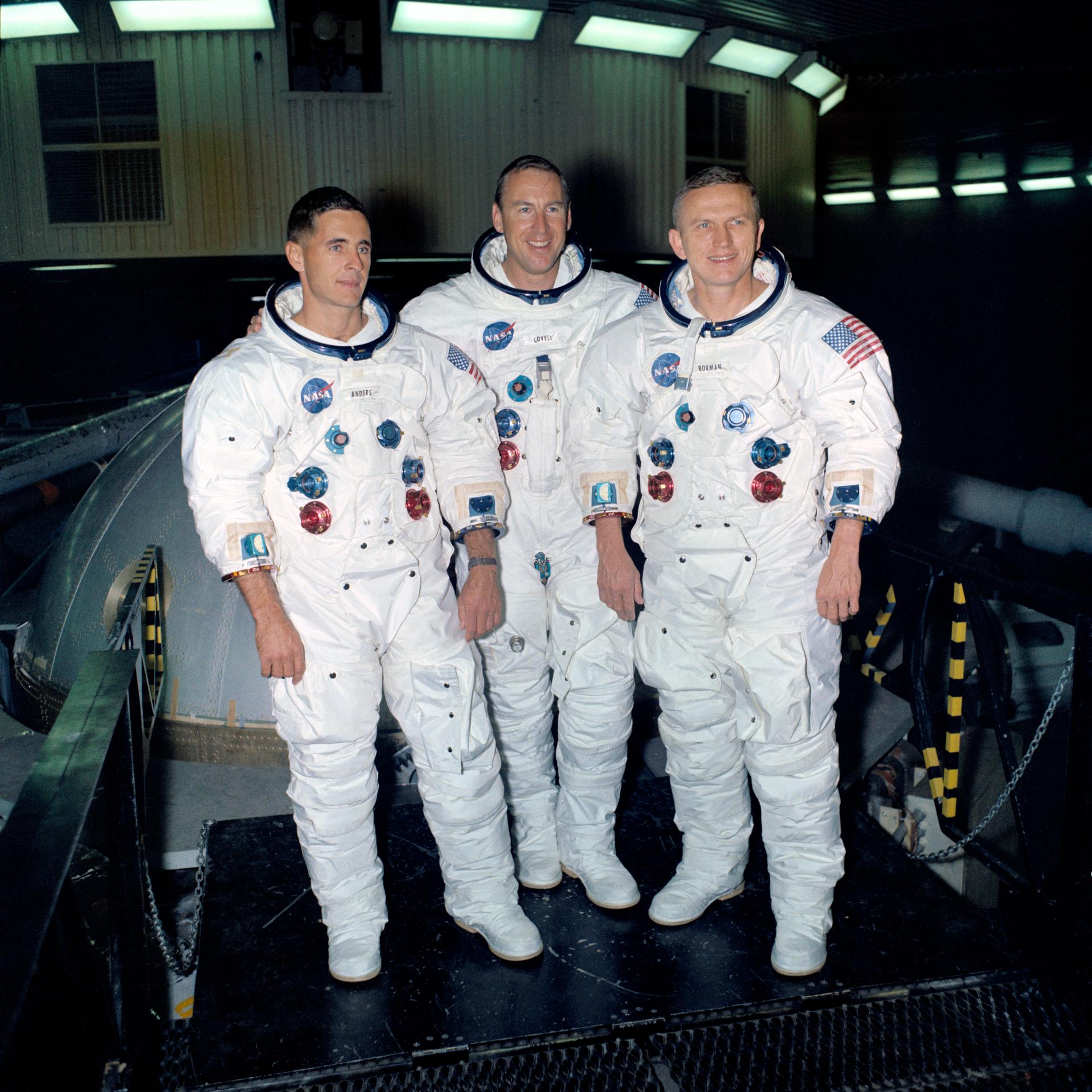 The crew of Apollo 8 poses in their space suits