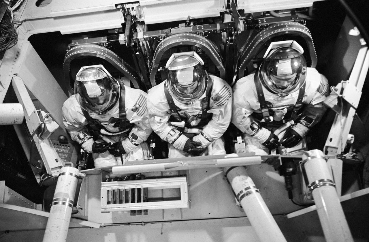 S68-53283 (1 Nov. 1968) --- The Apollo 8 prime crew is seen inside the gondola during centrifuge training in MSC's Flight Acceleration Facility, Building 29. Left to right, are astronauts William A. Anders, lunar module pilot, James A. Lovell Jr., command module pilot; and Frank Borman, commander.  Photo credit: NASA