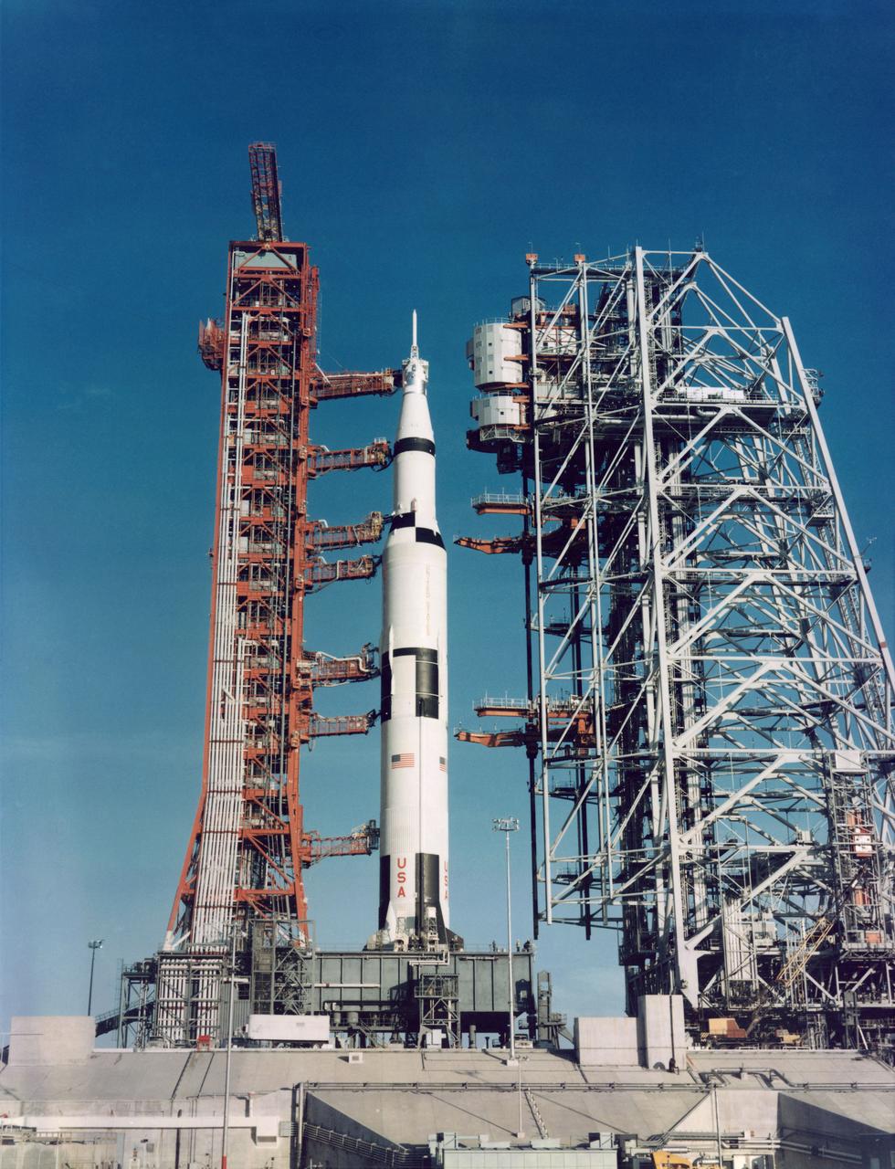 S68-55424 (17 Dec. 1968) --- Ground-level view of the Apollo 8 (Spacecraft 103/Saturn 503) space vehicle at Pad A, Launch Complex 39, Kennedy Space Center (KSC). The Apollo 8 stack was photographed during a prelaunch alert-mobile service structure pull back. (Mobile launch tower on left and mobile service structure on right.)