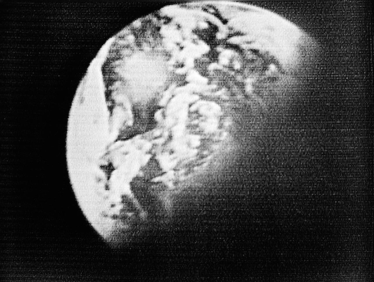 S68-56045 (26 Dec. 1968) --- Television viewers saw this picture of Earth during the sixth live telecast from the Apollo 8 spacecraft as it continued its journey home. At the time this picture was made, the Apollo 8 spacecraft, with astronauts Frank Borman, commander; James A. Lovell Jr., command module pilot; and William A. Anders, lunar module pilot, aboard, was about 97,000 nautical miles from Earth, and was traveling at a speed of 6,084 feet per second. As the spacecraft continued its trans-Earth course, the Apollo 8 crew noted that "Earth was getting larger" and that they were looking forward to being home.