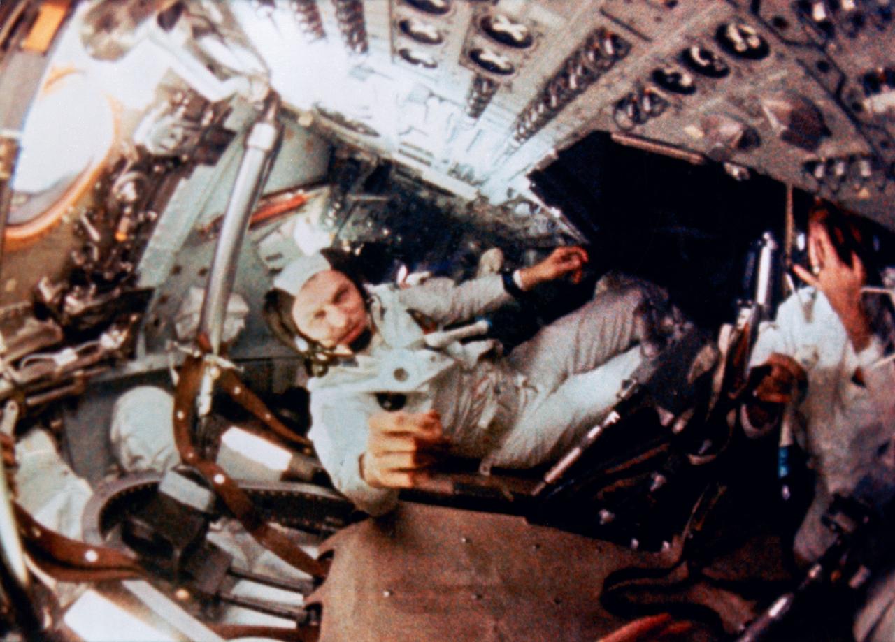 S68-56531 (21-27 Dec. 1968) --- Astronaut Frank Borman, mission commander, is shown during intravehicular activity (IVA) on the Apollo 8 lunar orbit mission. This still print was made from movie film exposed by an onboard 16mm motion picture camera.