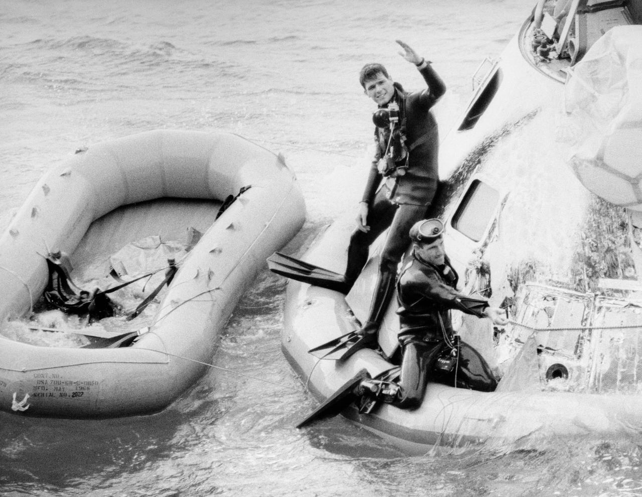 S69-15732 (27 Dec. 1968) --- A U.S. Navy frogman team participates in the Apollo 8 recovery operations. The Apollo crew, astronauts Frank Borman, James A. Lovell Jr., and William A. Anders, were recovered by helicopter and flown to the deck of the USS Yorktown, prime recovery ship for the historic Apollo 8 lunar orbit mission. Apollo 8 splashed down at 10:51 a.m. (EST), Dec. 27, 1968, about 1,000 miles south-southwest of Hawaii.