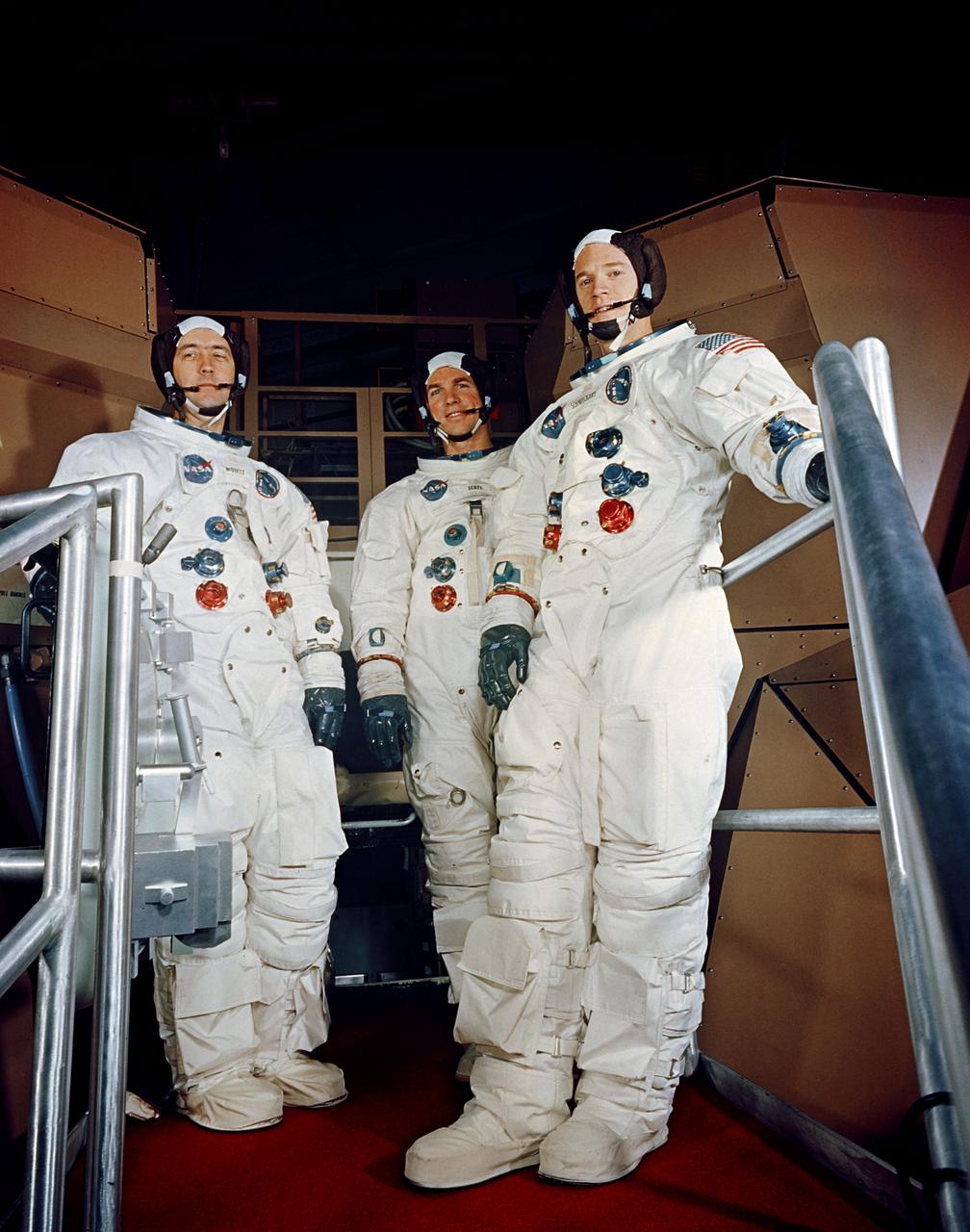S69-19983 (17 Feb. 1969) --- The Apollo 9 crew is shown suited up for a simulated flight in the Apollo Mission Simulator at the Kennedy Space Center (KSC). Left to right are astronauts James A. McDivitt, commander; David R. Scott, command module pilot; and Russell L. Schweickart, lunar module pilot.