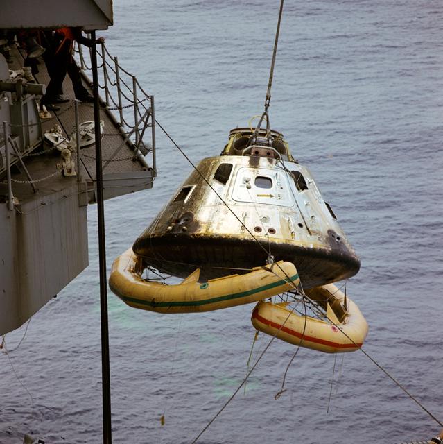 NASA image: Photo - Apollo/Saturn (A/S)-11 w/Flotation Collar Secured - Ship's Hoist