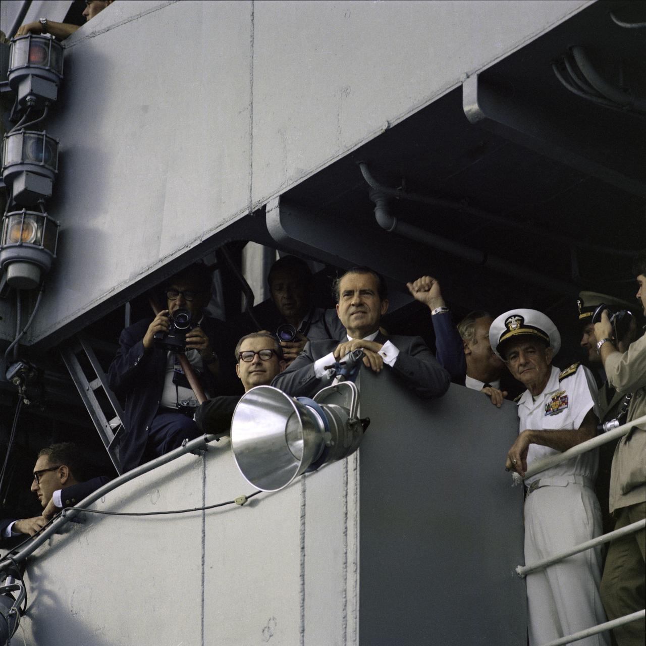 S69-21736 (24 July 1969) --- President Richard M. Nixon photographed on the deck of the USS Hornet, prime recovery ship for the Apollo 11 lunar landing mission, awaiting the Apollo 11 crew arrival. Apollo 11 splashed down at 11:40 a.m. (EDT), July 24, 1969, about 812 nautical miles southwest of Hawaii.