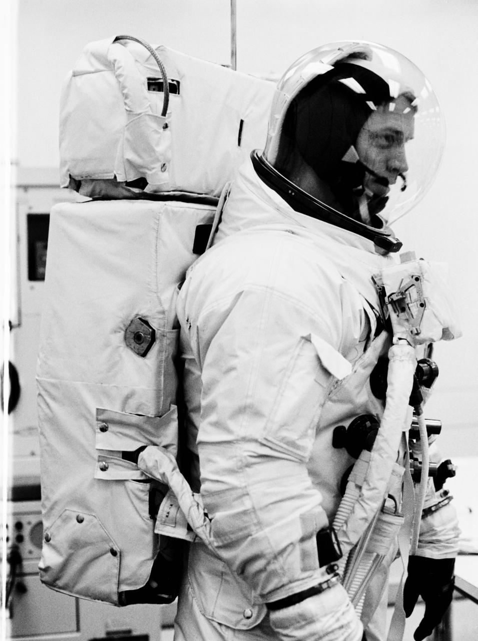 S69-25878 (23 Feb. 1969) --- Astronaut Russell L. Schweickart, lunar module pilot of the Apollo 9 prime crew, wears the Extravehicular Mobility Unit (EMU) which he will use during his scheduled Apollo 9 extravehicular activity. In addition to the space suit and bubble helmet, the EMU also includes a Portable Life Support System back pack, an Oxygen Purge System (seen atop the PLSS), and a Remote Control Unit on his chest. This equipment will be completely independent of the spacecraft during Schweickart's EVA. He will be secured only by a tether line. When this photograph was taken, Schweickart was suited to participate in an Apollo 9 Countdown Demonstration Test.