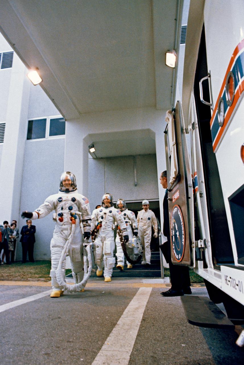 S69-25883 (3 March 1969) --- The Apollo 9 crew leaves the Kennedy Space Center's Manned Spacecraft Operations Building during the Apollo 9 prelaunch countdown. Leading is astronaut James A. McDivitt, commander; followed by astronaut David R. Scott, command module pilot; and Russell L. Schweickart, lunar module pilot. Moments later they entered the special transfer van which transported them to their waiting spacecraft at Pad A, Launch Complex 39. Apollo 9 was launched at 11 a.m. (EST), March 3, 1969, on a 10-day Earth-orbital mission.