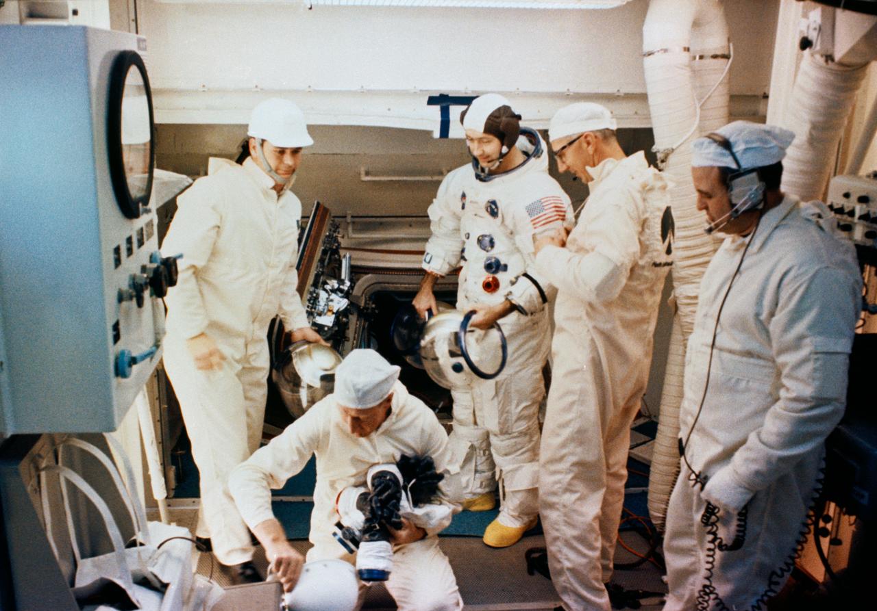S69-25884 (23 Feb. 1969) --- Interior view of the white room atop Pad A, Launch Complex 39, Kennedy Space Center, during Apollo 9 Countdown Demonstration Test activity. Standing next to spacecraft hatch is astronaut James A. McDivitt, commander. Also, taking part in the training exercise were astronauts David R. Scott, command module pilot; and Russell L. Schweickart, lunar module pilot. The Apollo 9 mission will evaluate spacecraft lunar module systems performance during manned Earth-orbital flight. Apollo 9 will be the second manned Saturn V mission.
