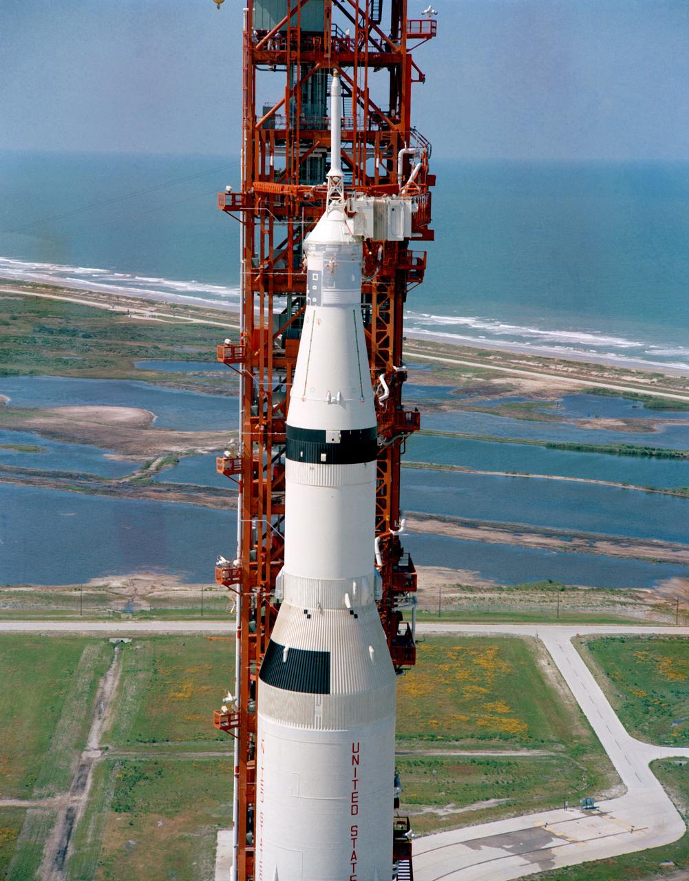 S69-33854 (4 May 1969) --- Aerial (high-angle, clasp) view of the Apollo 10 (Spacecraft 106/Lunar Module 4/Saturn 505) space vehicle on Pad B, Launch Complex 39, Kennedy Space Center. This photograph of the 363-feet tall Apollo/Saturn V stack was taken during pull back of the mobile service structure. The Apollo 10 crew will be astronauts Thomas P. Stafford, John W. Young, and Eugene A. Cernan.