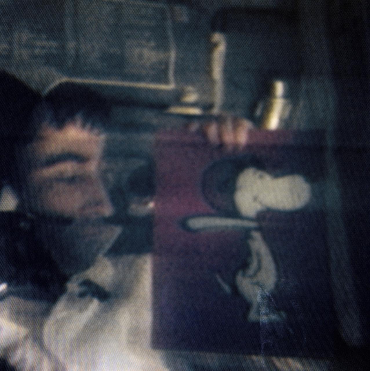 S69-34076 (19 May 1969) --- Astronaut John W. Young, Apollo 10 command module pilot, displays a drawing of Snoopy in this color reproduction taken from the fourth telecast made by the color television camera aboard the Apollo 10 spacecraft. When this picture was made the Apollo 10 spacecraft was about halfway to the moon, or approximately 112,000 nautical miles from Earth. Snoopy will be the code name of the Lunar Module (LM) during Apollo 10 operations when the Command Module (CM) and LM are separated. The CM's code name will be Charlie Brown. Also, aboard Apollo 10 were astronauts Thomas P. Stafford, commander; and Eugene A. Cernan, lunar module pilot.