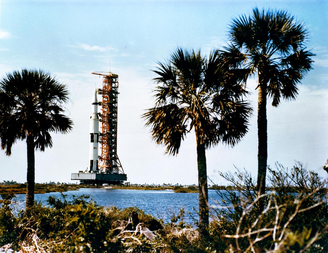 S69-34319 (11 March 1969) --- The 363-feet tall Apollo 10 (Spacecraft 106/Lunar Module 4/Saturn 505) space vehicle on the way from the Vehicle Assembly Building to Pad B, Launch Complex 39, Kennedy Space Center. The Saturn V stack and its mobile launch tower are atop a huge crawler-transporter.