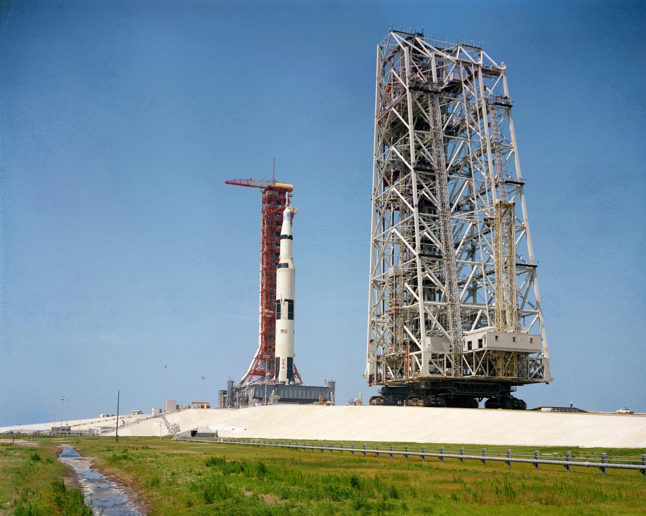 S69-34320 (17 May 1969) --- Ground level view of the 363-feet tall Apollo 10 (Spacecraft 106/Lunar Module 4/Saturn 505) space vehicle on Pad B, Launch Complex 39, Kennedy Space Center. The service structure is in the right foreground. The crew of the Apollo 10 lunar orbit mission will be astronauts Thomas P. Stafford, commander; John W. Young, command module pilot; and Eugene A. Cernan, lunar module pilot.