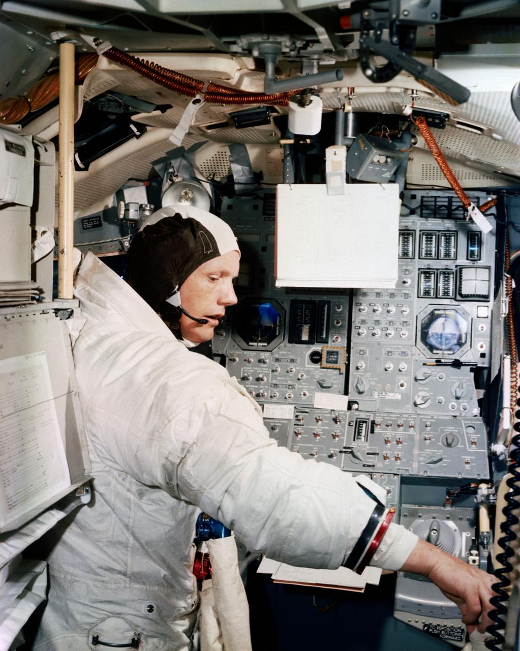 S69-38677 (19 June 1969) --- Astronaut Neil A. Armstrong, Apollo 11 commander, participates in simulation training in preparation for the scheduled lunar landing mission.  He is in the Apollo Lunar Module Mission Simulator in the Kennedy Space Center (KSC) Flight Crew Training Building.  The other two crewmen of the historic flight are astronauts Michael Collins, command module pilot; and Edwin E. Aldrin Jr., lunar module pilot.