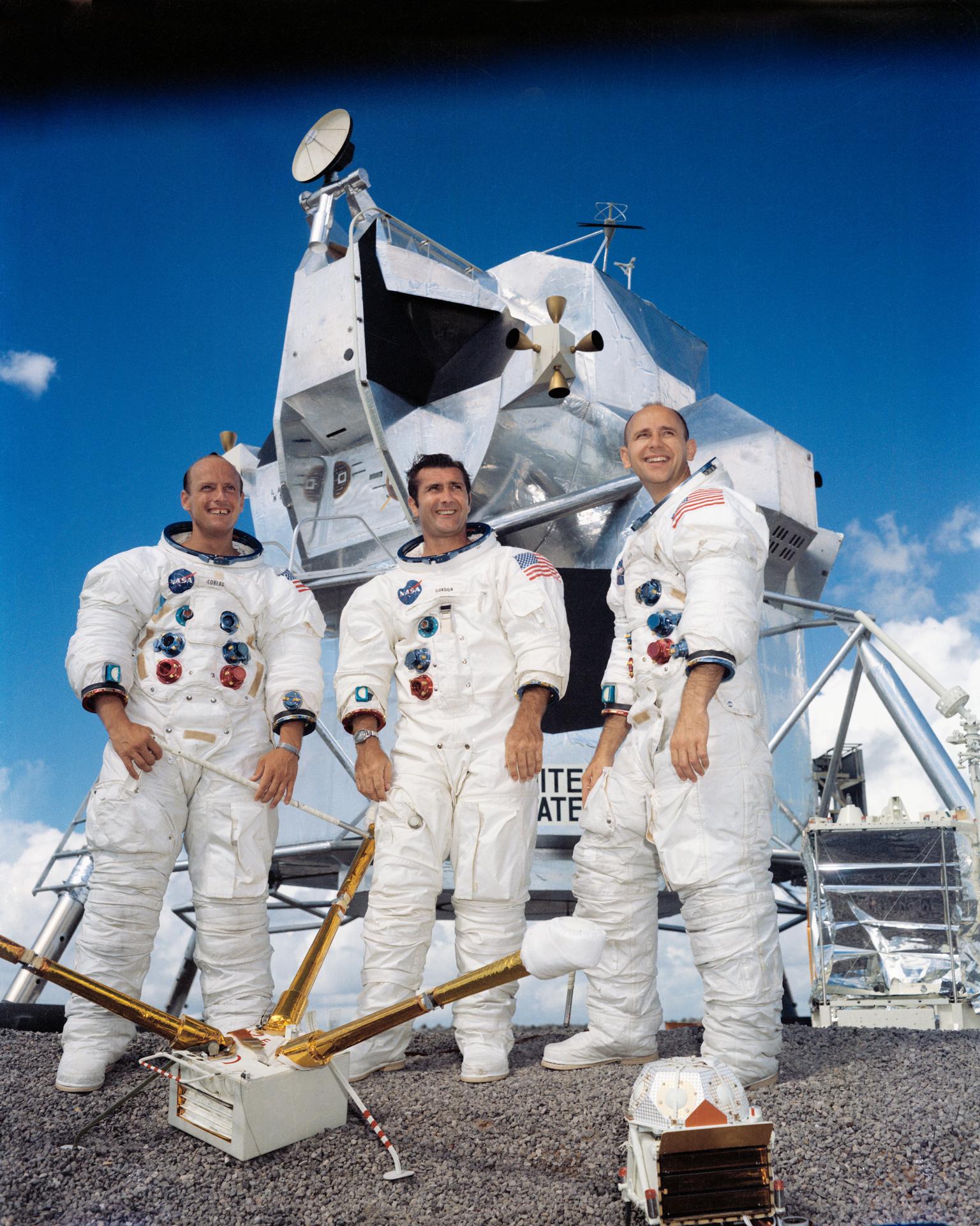 Portrait of the prime crew of Apollo 12. Charles Conrad Jr., Richard F. Gordon Jr., and Alan L. Bean pose in front of the lunar module.