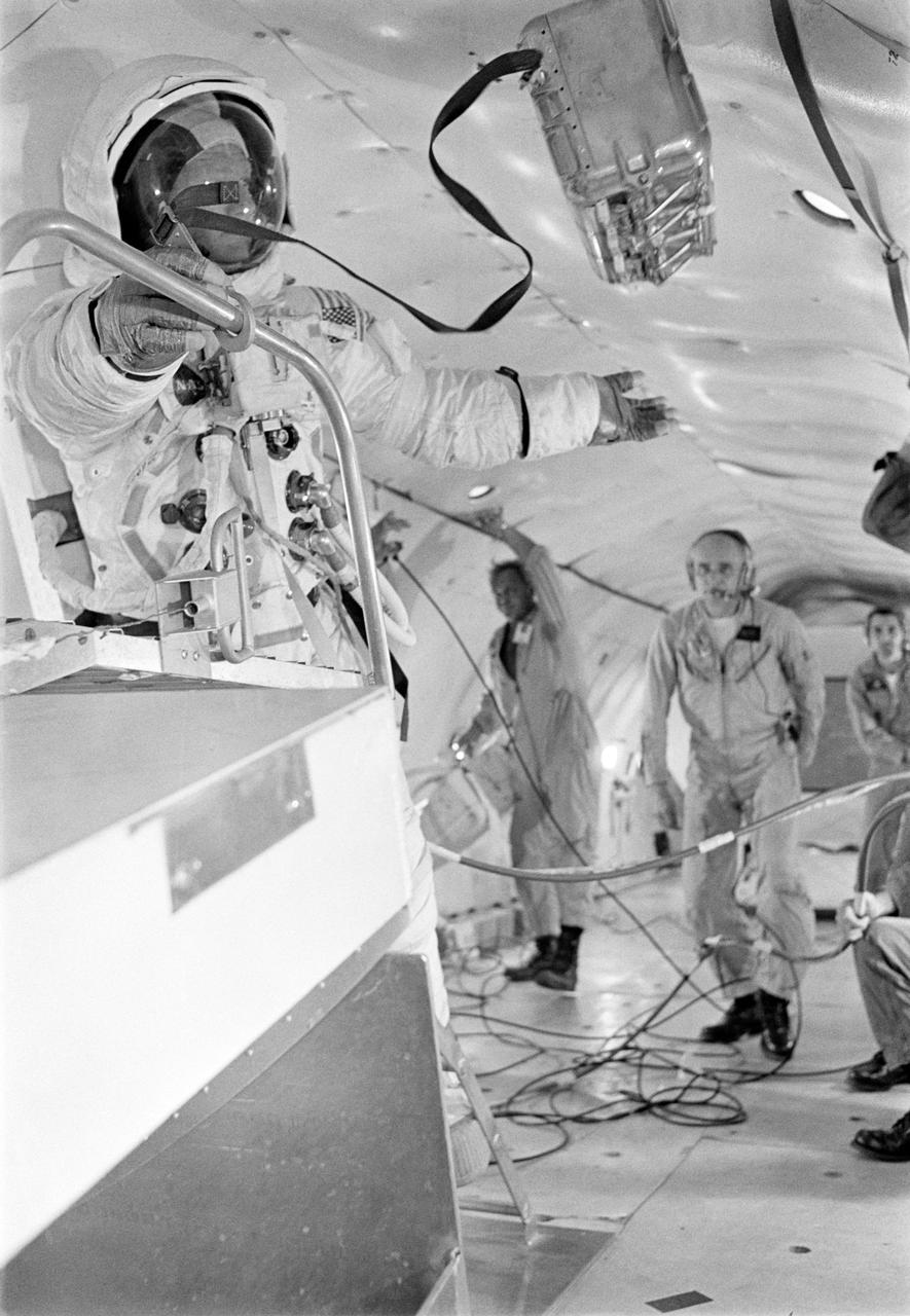 S69-39270 (10 July 1969)  --- Astronaut Edwin E. Aldrin Jr., lunar module pilot of the Apollo 11 lunar landing mission, participates in lunar extravehicular activity training under weightlessness conditions aboard a U.S. Air Force KC-135 jet aircraft from nearby Patrick Air Force Base.  Aldrin is wearing an Extravehicular Mobility Unit, the type of equipment which he will wear on the lunar surface.