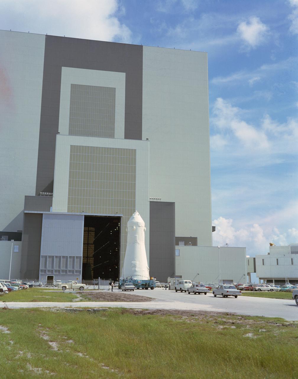 S69-39323 (1969) --- The Apollo 12 spacecraft (Command and Service Modules 108/Lunar Module 6) arrives at the Kennedy Space Center's Vehicle Assembly Building (VAB) during preflight preparations. The spacecraft had just been moved from the Manned Spacecraft Operations Building.