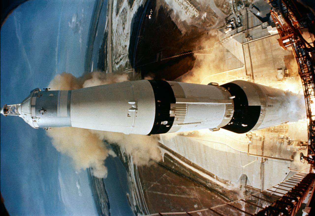 S69-39959 (16 July 1969) --- The huge, 363-feet tall Apollo 11 (Spacecraft 107/Lunar Module 5/ Saturn 506) space vehicle is launched from Pad A, Launch Complex 39, Kennedy Space Center (KSC), at 9:32 a.m. (EDT), July 16, 1969. Aboard the Apollo 11 spacecraft were astronauts Neil A. Armstrong, commander; Michael Collins, command module pilot; and Edwin E. Aldrin Jr., lunar module pilot. Apollo 11 is the United States' first lunar landing mission. This view of the liftoff was taken by a camera mounted on the mobile launch tower. While astronauts Armstrong and Aldrin descend in the Lunar Module (LM) "Eagle" to explore the Sea of Tranquility region of the moon, astronaut Collins will remain with the Command and Service Modules (CSM) "Columbia" in lunar orbit. Photo credit: NASA