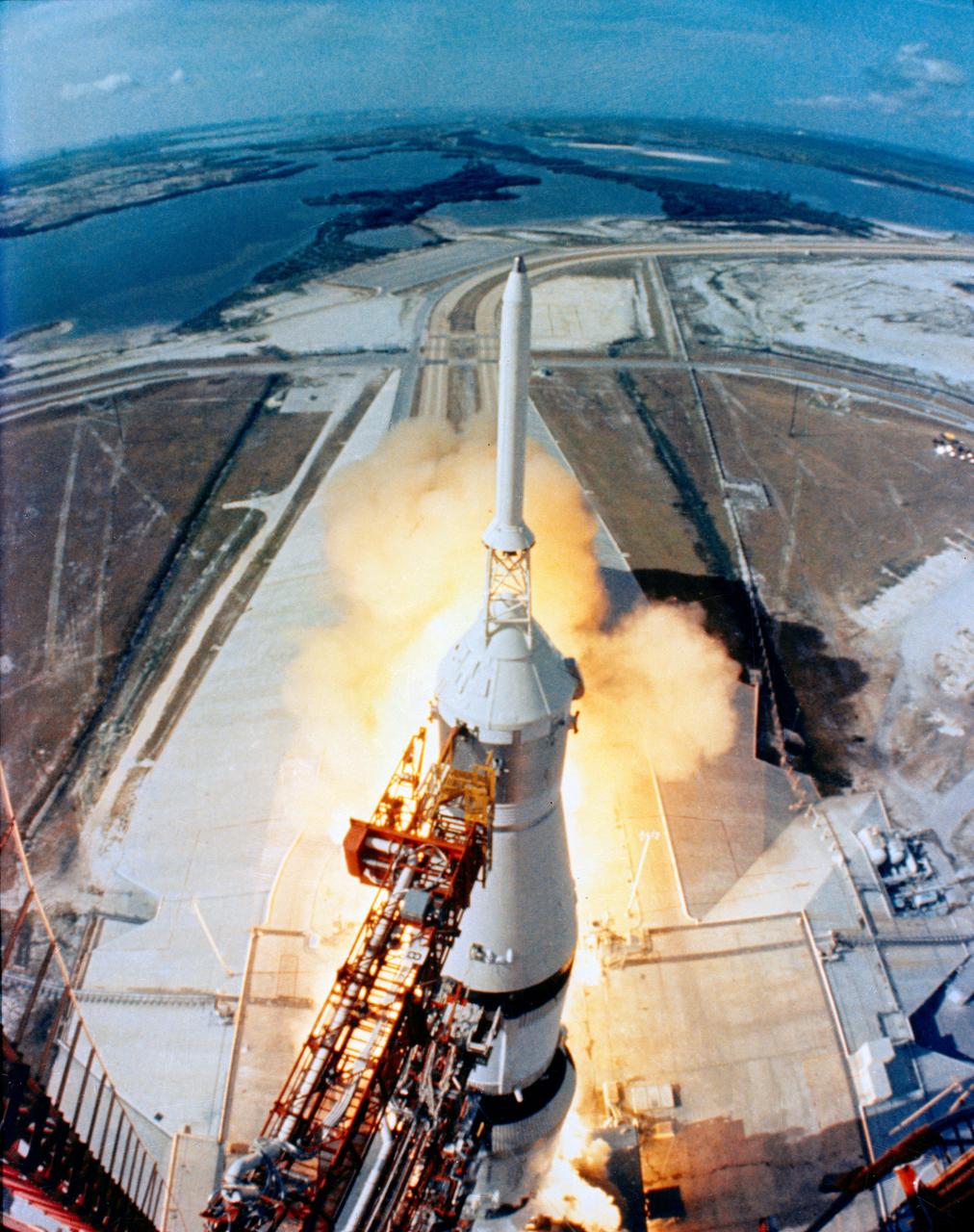 S69-39962 (16 July 1969) --- The huge, 363-feet tall Apollo 11 (Spacecraft 107/Lunar Module 5/Saturn 506) space vehicle is launched from Pad A, Launch Complex 39, Kennedy Space Center (KSC), at 9:32 a.m. (EDT), July 16, 1969. Aboard the Apollo 11 spacecraft were astronauts Neil A. Armstrong, commander; Michael Collins, command module pilot; and Edwin E. Aldrin Jr., lunar module pilot. Apollo 11 is the United States' first lunar landing mission. This view of the liftoff was taken by a camera mounted on the mobile launch tower. While astronauts Armstrong and Aldrin descend in the Lunar Module (LM) "Eagle" to explore the Sea of Tranquility region of the moon, astronaut Collins will remain with the Command and Service Modules (CSM) "Columbia" in lunar orbit.