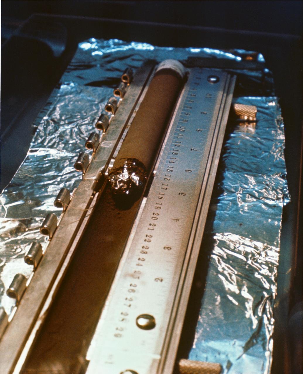 S69-40945 (August 1969) --- This is a core tube sample under study and examination in the Manned Spacecraft Center?s (MSC) Lunar Receiving Laboratory (LRL). The sample was among lunar soil and rock samples collected by astronauts Neil A. Armstrong and Edwin E. Aldrin Jr. during their extravehicular activity (EVA) on July 20, 1969. While astronauts Armstrong, commander; and Aldrin, lunar module pilot; descended in the Apollo 11 Lunar Module (LM) "Eagle" to explore the Sea of Tranquility landing site on the moon.  Astronaut Michael Collins, command module pilot, remained with the Command and Service Modules (CSM) "Columbia" in lunar orbit.