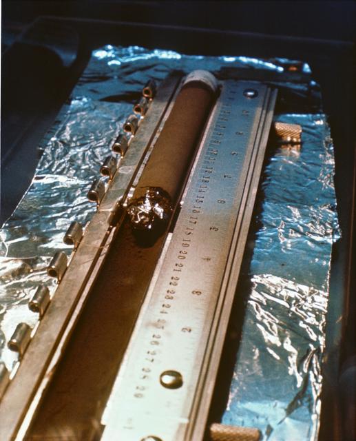 NASA image: View of undisturbed lunar sediment as core tube from Apollo 11 is opened