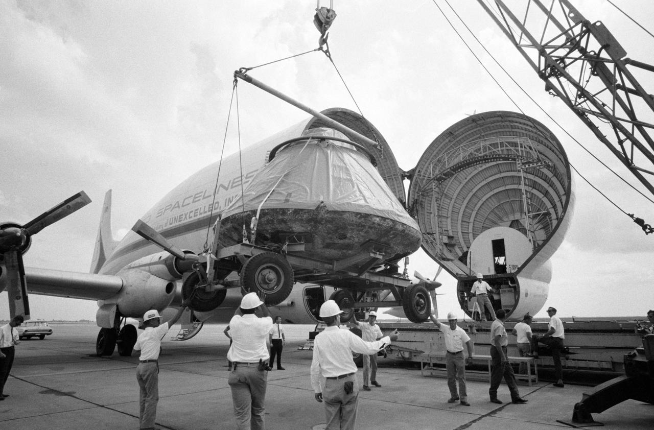 S69-41985 (14 Aug. 1969) --- The Apollo 11 spacecraft Command Module (CM) is loaded aboard a Super Guppy Aircraft at Ellington Air Force Base for shipment to the North American Rockwell Corporation at Downey, California.  The CM was just released from its postflight quarantine at the Manned Spacecraft Center (MSC). The Apollo 11 spacecraft was flown by astronauts Neil A. Armstrong, commander; Michael Collins, command module pilot; and Edwin E. Aldrin Jr., lunar module pilot, during their lunar landing mission.  Note damage to aft heat shield caused by extreme heat of Earth reentry.  North American Rockwell is the prime contractor for the Apollo Command and Service Modules (CSM).