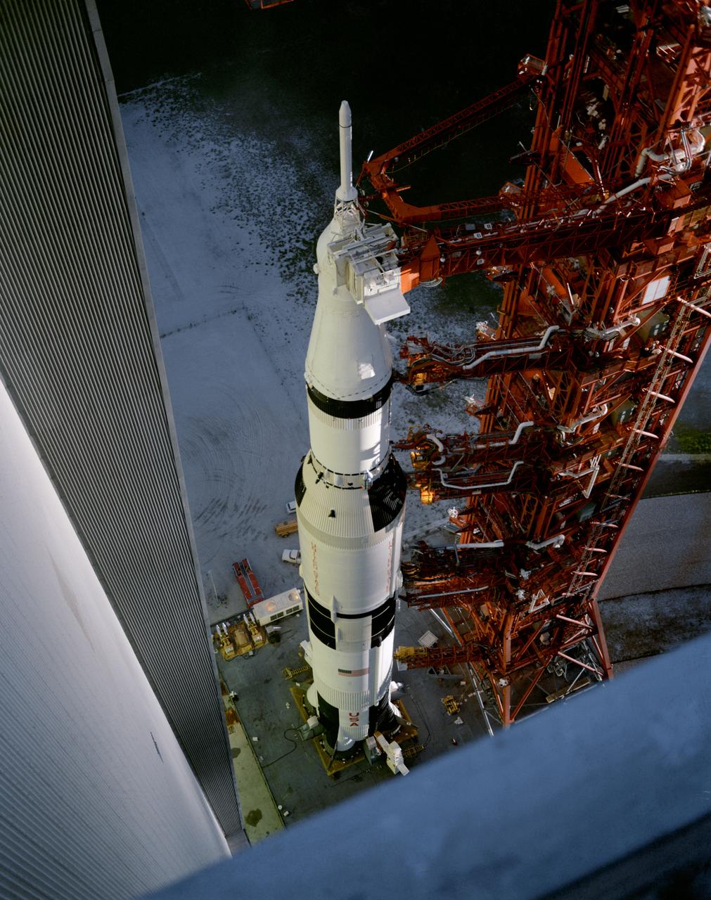 S69-51308 (8 Sept. 1969) --- High-angle view at Launch Complex 39, Kennedy Space Center (KSC), showing the Apollo 12 (Spacecraft 108/ Lunar Module 6/ Saturn 507) space vehicle leaving the Vehicle Assembly Building (VAB) on the way to Pad A. The Saturn V stack and its mobile launch tower are atop a huge crawler-transporter. Apollo 12 is scheduled as the second lunar landing mission. The crew will be astronauts Charles Conrad Jr., commander; Richard F. Gordon Jr., command module pilot; and Alan L. Bean, lunar module pilot.