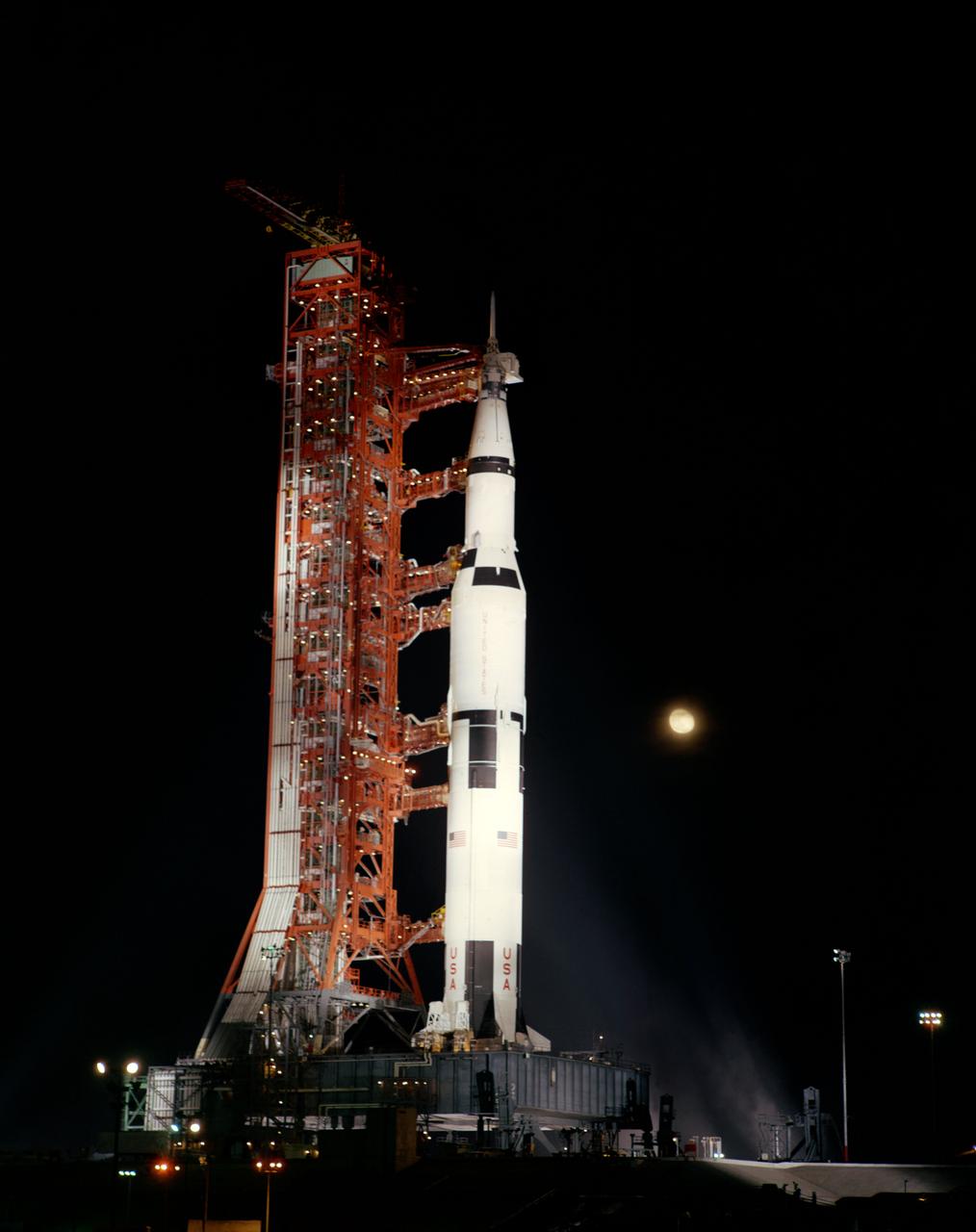 S69-56596 (28 Oct. 1969) --- A nighttime, ground-level view of Pad A, Launch Complex 39, Kennedy Space Center (KSC) showing the Apollo 12 (Spacecraft 108/Lunar Module 6/Saturn 507) space vehicle, during the terminal phase of a Countdown Demonstration Test (CDDT). The crew of the National Aeronautics and Space Administration's (NASA) second lunar landing mission will be astronauts Charles Conrad Jr., commander; Richard F. Gordon Jr., command module pilot; and Alan L. Bean, lunar module pilot. The Apollo 12 launch has been scheduled for 11:22 a.m. (EST) on Nov. 14, 1969.