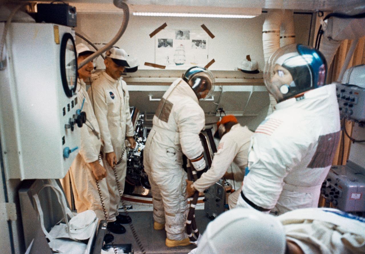 S69-58885 (14 Nov. 1969) --- Interior view of the White Room atop Pad A, Launch Complex 39, Kennedy Space Center (KSC), during the insertion of the Apollo 12 crew. In the center background preparing to ingress the spacecraft is astronaut Charles Conrad Jr., commander. Astronaut Alan L. Bean, lunar module pilot, stands in the right foreground. Awaiting his turn to ingress, but out of view, is astronaut Richard F. Gordon Jr., command module pilot. The Apollo 12 is the United States' second lunar landing mission.