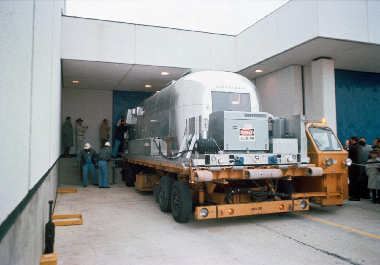 A Mobile Quarantine Facility (MQF), with the crew of the Apollo XII Lunar Landing Mission aboard, is shown on arriving at JSC, Saturday morning, 11/29/1969.