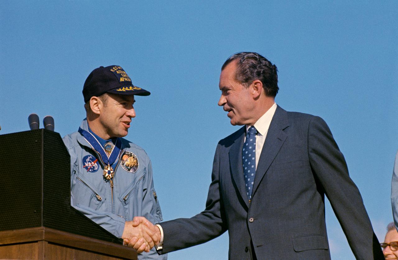 S70-15506 (18 April 1970) --- President Richard M. Nixon and astronaut James A. Lovell Jr., Apollo 13 commander, shake hands at special ceremonies at Hickam Air Force Base, Hawaii.  President Nixon was in Hawaii to present the Apollo 13 crew with the Presidential Medal of Freedom, the nation's highest civilian honor.  The wives of astronauts Lovell and Fred W. Haise Jr., lunar module pilot; and the parents of astronaut John L. Swigert Jr., command module pilot, flew with the Chief Executive to Hickam Air Force Base. The Apollo 13 splashdown occurred at 12:07:44 p.m. (CST), April 17, 1970, a day and a half prior to the awards ceremony.
