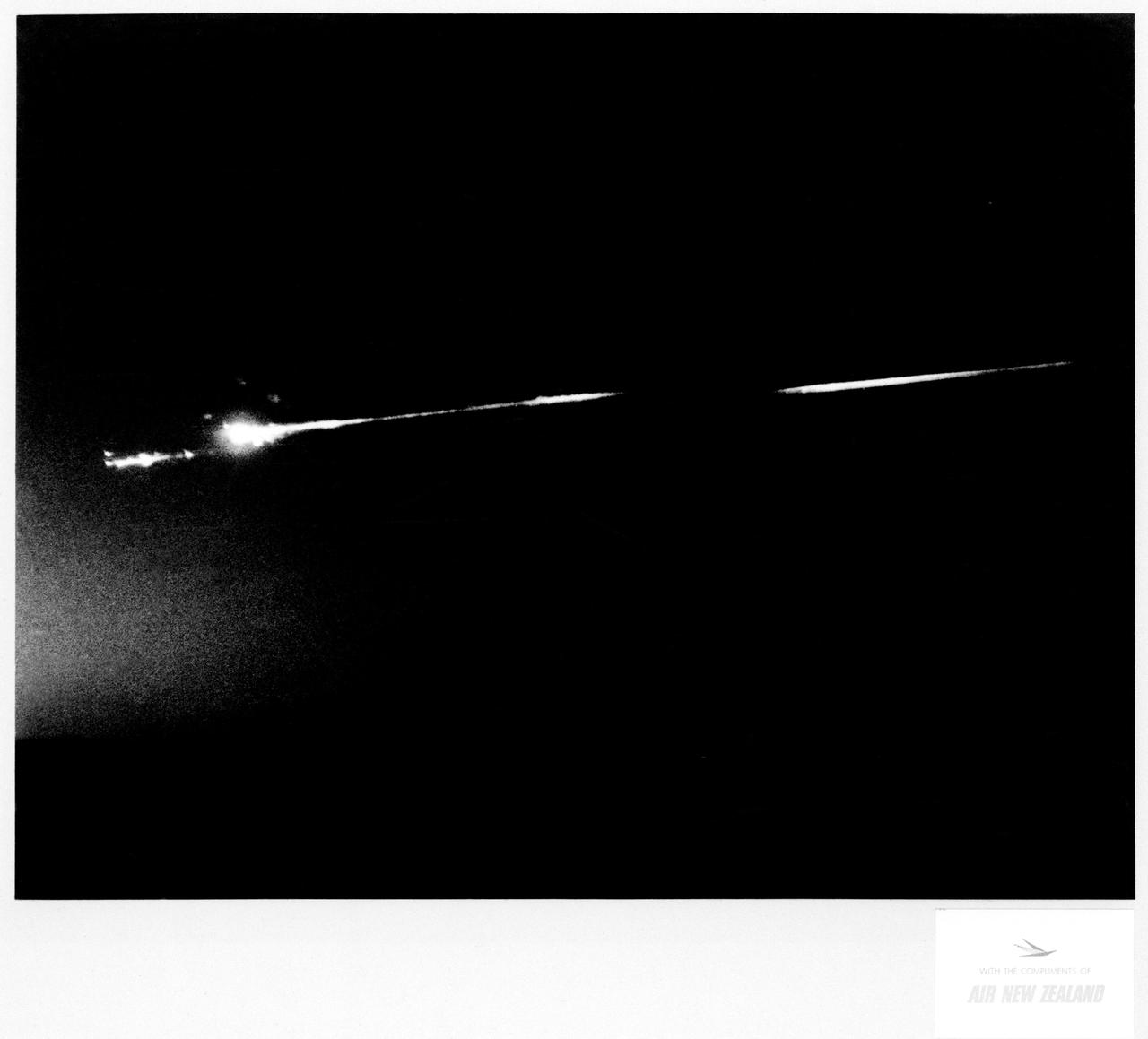 S70-17646 (18 April 1970) --- An unidentified airline passenger snapped these bright objects, believed to be the Apollo 13 Service Module (SM) and Lunar Module (LM) as they entered Earth's atmosphere over the Pacific Ocean on April 18, 1970.  The aircraft, an Air New Zealand DC-8 was midway between the Fiji Islands (Nandi Island to be specific) and Auckland, New Zealand, when the photograph was taken.  The crew men of the problem plagued Apollo 13 mission jettisoned the LM and SM prior to entering Earth's atmosphere in the Apollo 13 Command Module (CM).