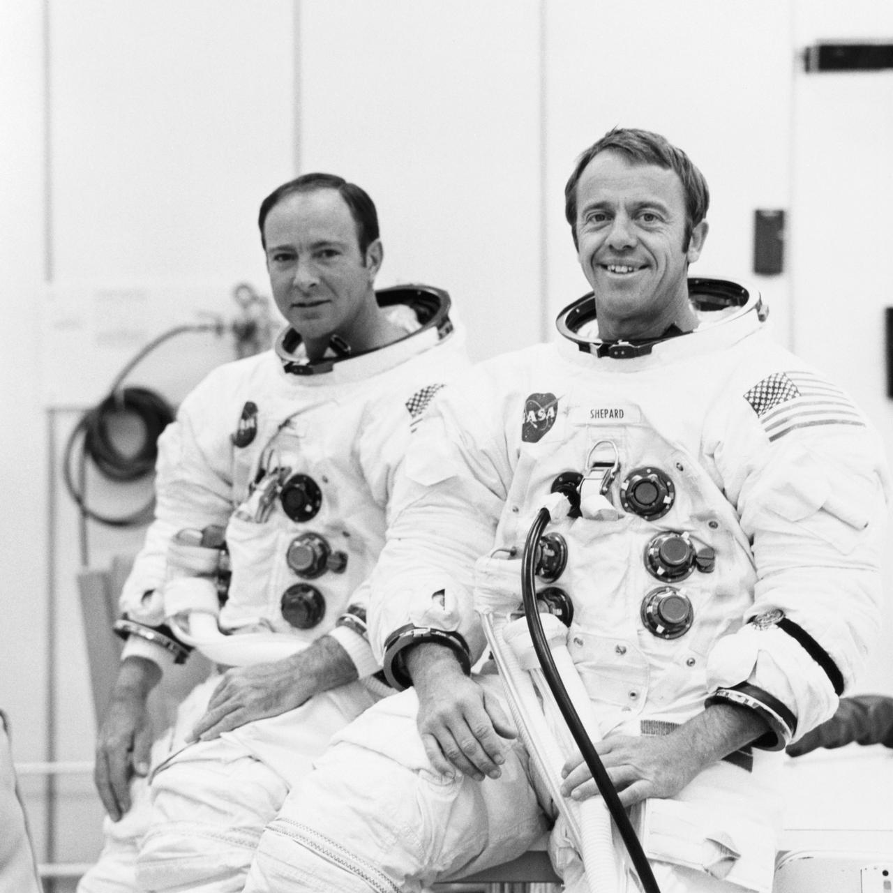 S70-19764 (18 Sept. 1970) --- Astronauts Alan B. Shepard Jr. (right), commander, and Edgar D. Mitchell, lunar module pilot, are suited up for a manned altitude run in the Apollo 14 Lunar Module. The manned run in a vacuum chamber of the Manned Spacecraft Operations Building was conducted to validate the LM's communications and guidance and navigation systems. Apollo 14 is scheduled for launch from Cape Kennedy on Jan. 31, 1971, on a lunar exploration mission which is to carry Shepard and Mitchell down to the moon's rugged Fra Maura highlands region. Astronaut Stuart A. Roosa, command module pilot, will remain with the Apollo 14 Command and Service Modules in lunar orbit while the other two astronauts explore the moon.