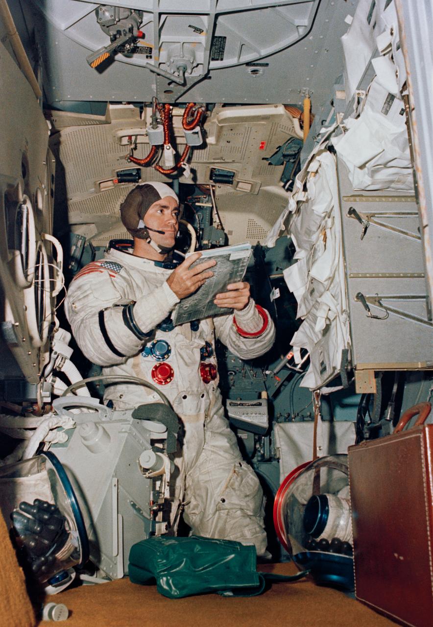 S70-34412 (4 April 1970) --- Astronaut Fred W. Haise Jr., Apollo 13 lunar module pilot, participates in simulation training in preparation for the scheduled lunar landing mission. He is in the Apollo Lunar Module Mission Simulator in the Kennedy Space Center's Flight Crew Training building.