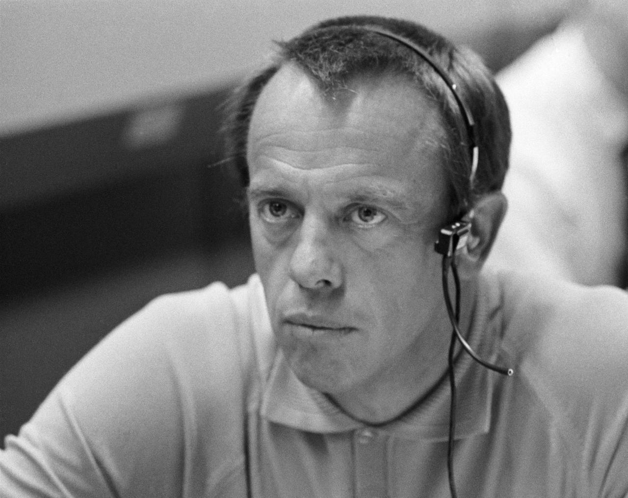 S70-34904 (14 April 1970) --- Astronaut Alan B. Shepard Jr., prime crew commander of the Apollo 14 mission, monitors communications between the Apollo 13 spacecraft and Mission Control Center.  He is seated at a console in the Mission Operations Control Room of the MCC, Manned Spacecraft Center.  The main concern of the moment was action taken by the three Apollo 13 crewmen - astronauts James A. Lovell Jr., John L. Swigert Jr. and Fred W. Haise Jr. - to make corrections inside the spacecraft following discovery of an oxygen cell failure several hours earlier.