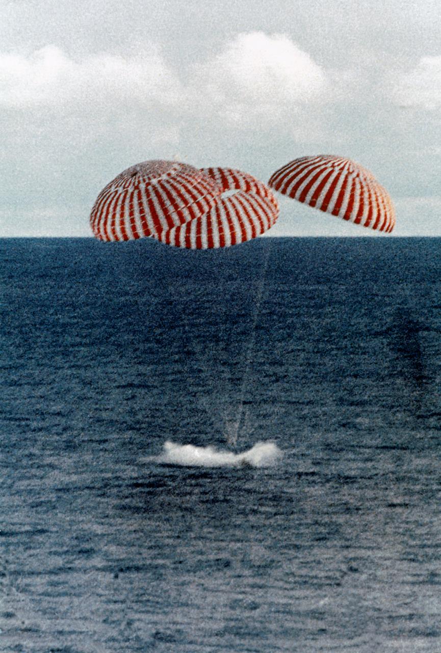 S70-35638 (17 April 1970) --- A perilous space mission comes to a smooth ending with the safe splashdown of the Apollo 13 Command Module (CM) in the South Pacific, only four miles from the prime recovery ship. The spacecraft with astronauts James A. Lovell Jr., John L. Swigert Jr., and Fred W. Haise Jr. aboard, splashed down at 12:07:44 p.m. (CST) April 17, 1970, to conclude safely the problem-plagued flight. The crewmen were transported by helicopter from the immediate recovery area to the USS Iwo Jima, prime recovery vessel.