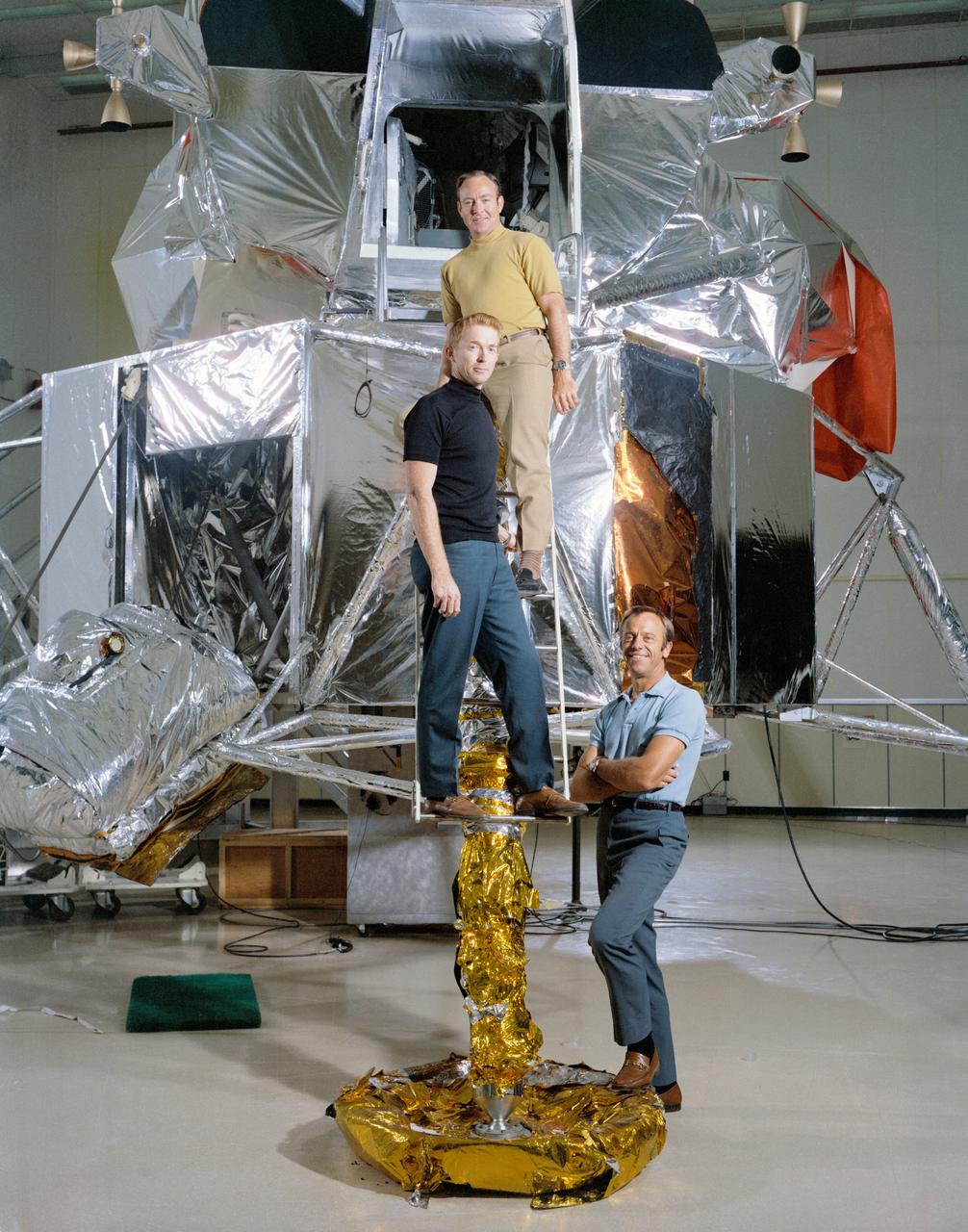 S70-45581 (July 1970) --- The members of the prime crew of the Apollo 14 lunar landing mission are photographed during training activity at the Kennedy Space Center. From foreground are astronauts Alan B. Shepard Jr., commander; Stuart A. Roosa, command module pilot; and Edgar D. Mitchell, lunar module pilot. They are standing in front of a Lunar Module mock-up.
