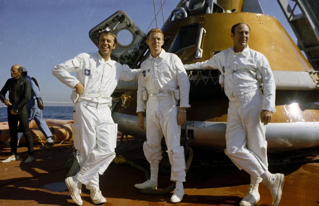 S70-51699 (24 Oct. 1970) --- The prime crew of the Apollo 14 lunar landing mission relaxes aboard the NASA motor vessel retriever, prior to participating in water egress training in the Gulf of Mexico. Left to right are astronauts Alan B. Shepard Jr., commander; Stuart A. Roosa, command module pilot; and Edgar D. Mitchell, lunar module pilot. They are standing by a Command Module (CM) trainer which was used in the exercises.
