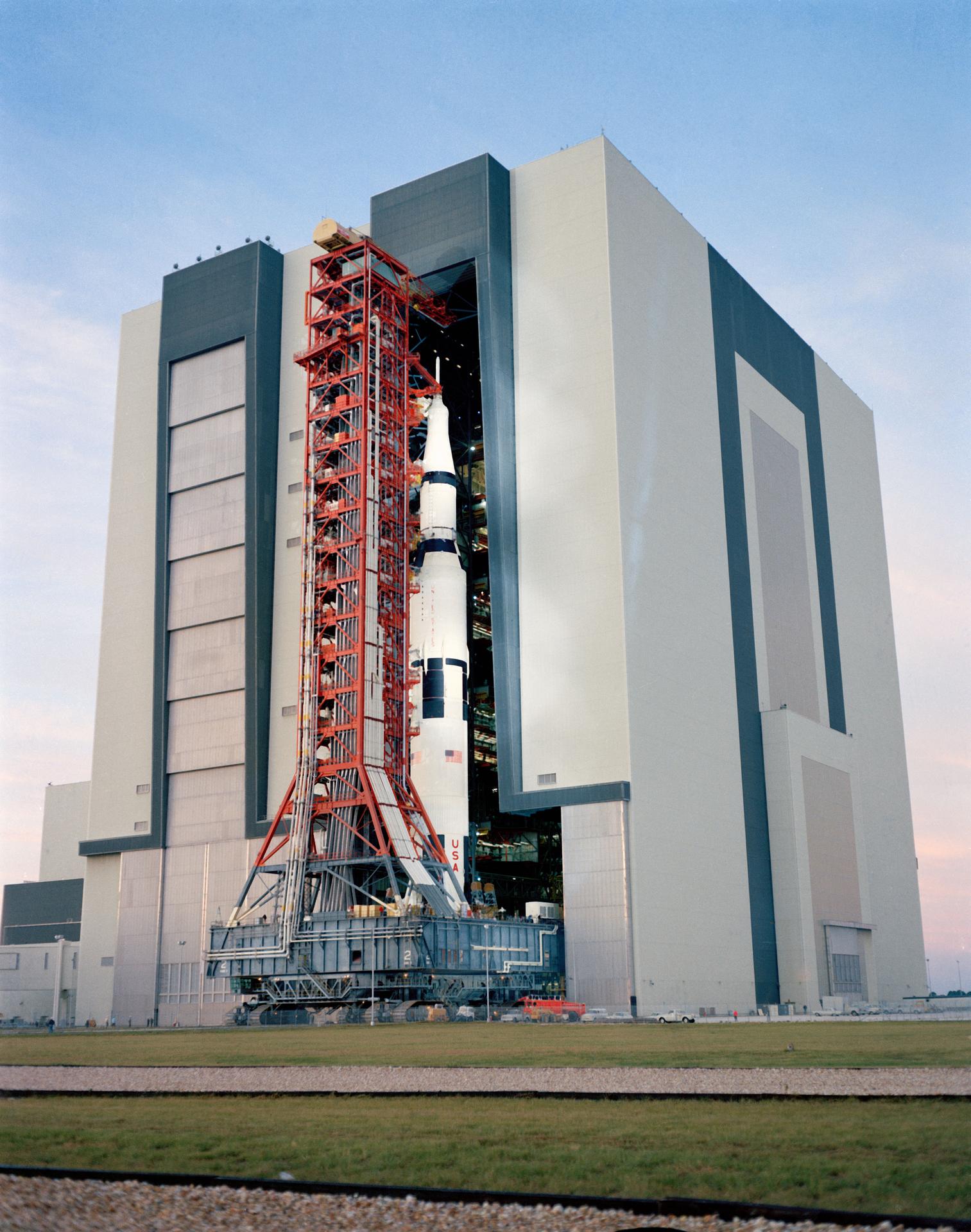 ground level view showing the Apollo 14 space vehicle leaving the Vehicle Assembly Building.