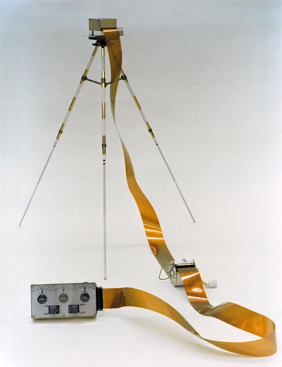 S70-56721 (December 1970) --- A close-up view of the Lunar Portable Magnetometer (LPM), which will be used by the crew of the Apollo 14 lunar landing mission during the second extravehicular activity (EVA). The LPM's components, a tripod-mounted flux-gate magnetometer sensor head and an electronics data package, connected by a 50-feet flat cable, function together to measure variations in the lunar magnetic field at several points on the geological traverse. Data gathered will be used to determine the location, strength and dimensions of magnetic sources, as well as knowledge of the local and total selenological structure. The LPM will be carried on the Modular Equipment Transporter (MET), and deployed by the lunar module pilot, who will align the sensor head at least 35 feet from the data package. The LM pilot will then return to the MET and verbally relay the LPM readouts to Earth. Astronaut Edgar D. Mitchell is the lunar module pilot for the Apollo 14 lunar landing mission.